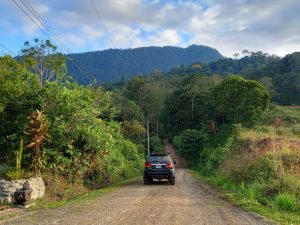 Car driving through mountains.