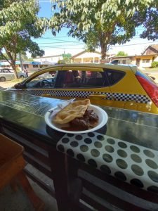 Food near a taxi.