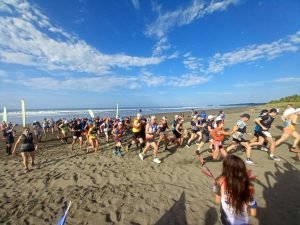 People running on beach.