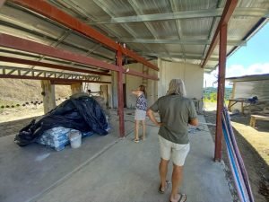 People inspecting a house under construction.