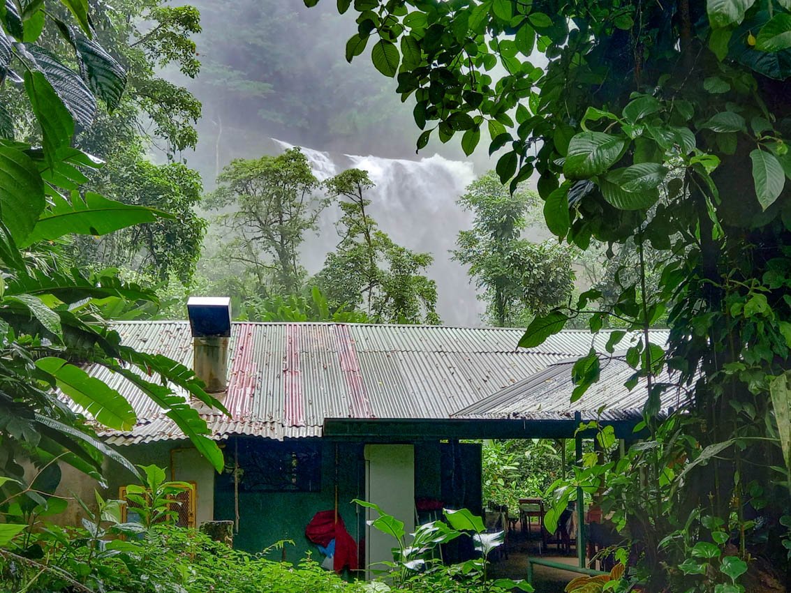 A view of the restaurant and the nearby waterfall. 