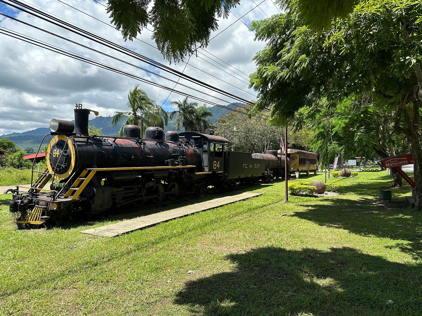 Engine 84, located in a park in Palmar Sur. This engine, and many like it, begun hauling freight in the 1940s and, together with trucks and tractors, took over many of the Oxcart's primary jobs.