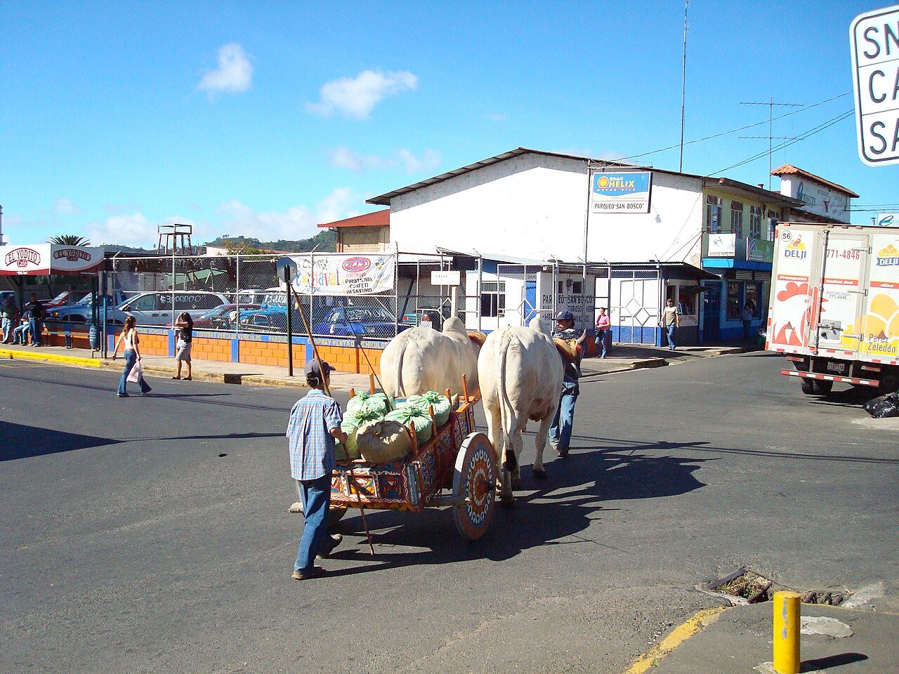 Oxcart transporting market goods. c/o wikicommons.