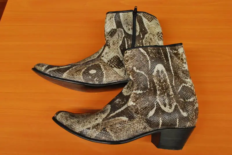 Boa-skin shoes. Boas are still hunted this day, their skin used to produce shoes, purses, belts and other items.