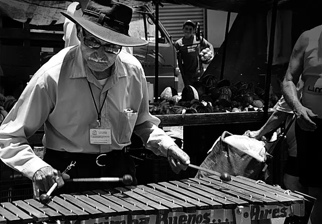 A traditional Marimbista playing the instrument. c/o wikicommons.