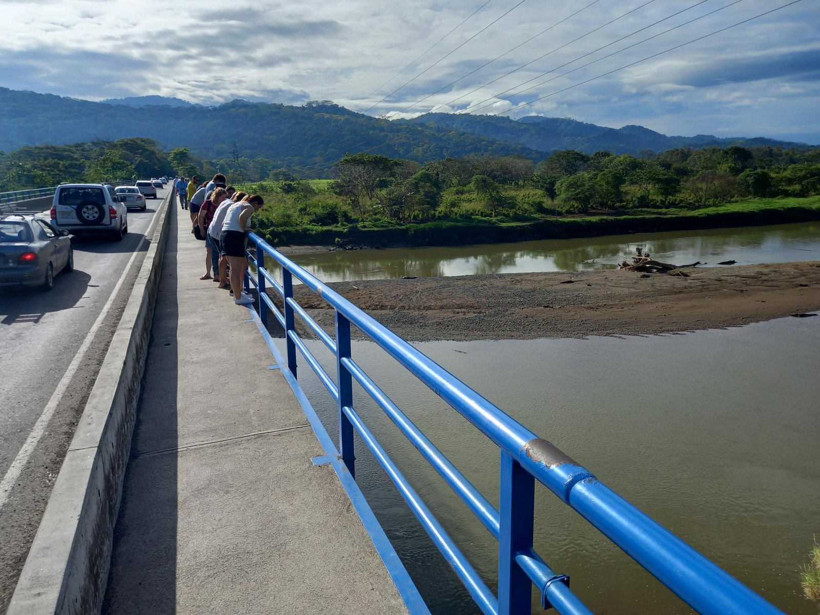 The new tourist pathway separates the curious from the traffic. It is a big improvement over the dangerous situation that existed in the past. The crocodiles lurk in the river or sun themselves on the sandy banks and islands. 