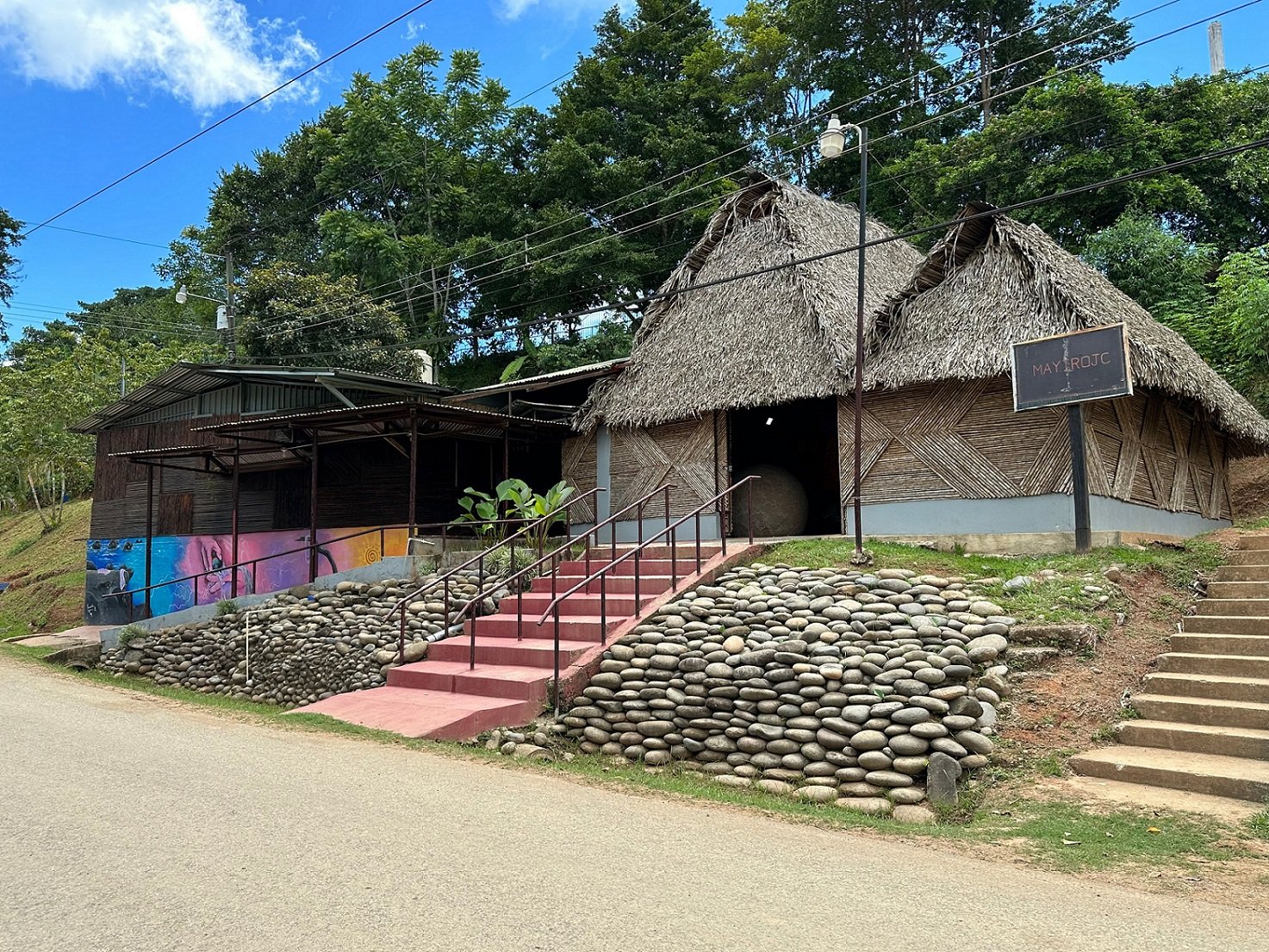 A museum in the Boruca village. You can just make out an original stone sphere visible inside the thatched museum building. 