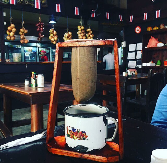 Costa Rica's unique brewing method - the chorreador, or 'coffee sock'. This method allows for a slow extraction, intensifying the flavor.