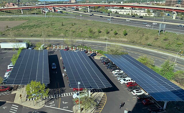 Solar panels over a carpark - these solar farms use already existing land and, i addition, protect public areas from the sun and rain. c/o pedrik, wikicommons.