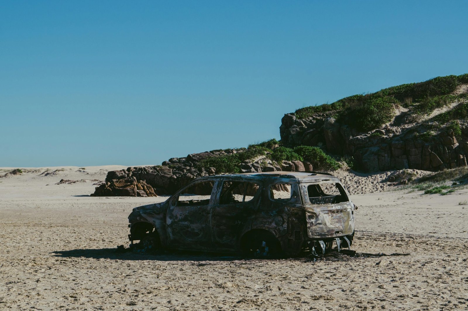 A common fate of all those who make it a habit to park their cars on beaches. c/o co Gilberto Olimpio, wikicommons.