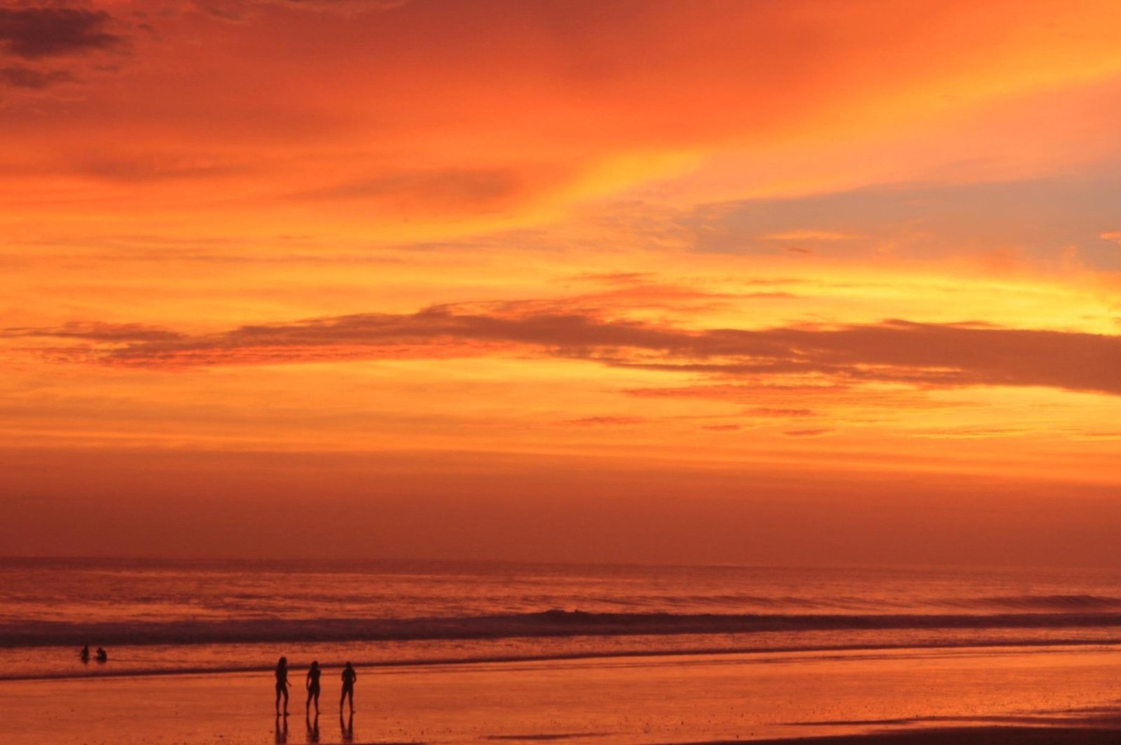 A fire-red Playa Uvita sunset.